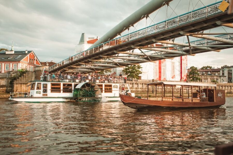 Krakow: Vistula Night Cruise by Gondola w/ Audio Commentary - Getting to Mauritania Barge by Bernatka footbridge