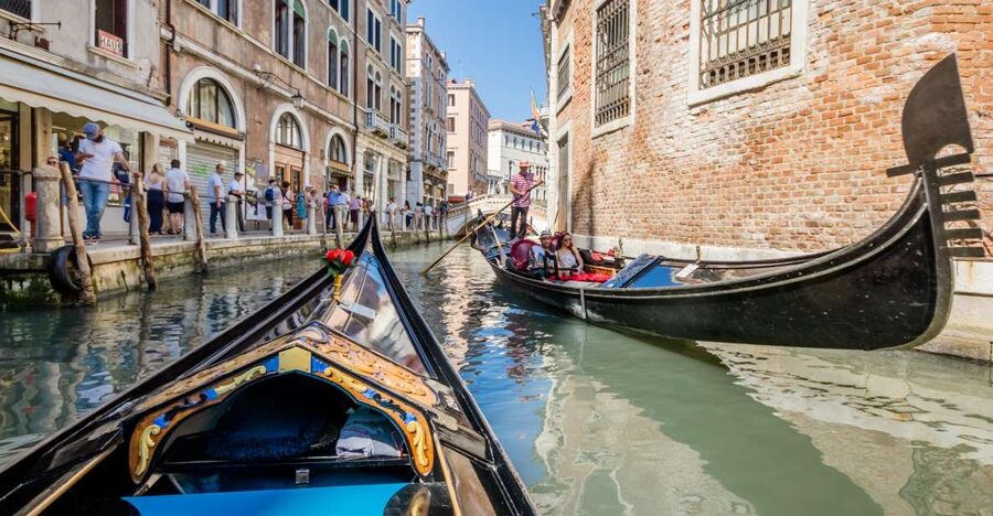 Venice: Shared Gondola Ride Across the Grand Canal - Gondolier Style: Professional, Calm, and Often Quiet